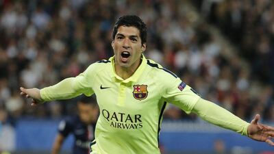 Luis Suarez celebrates scoring Barca's third goal in their 3-1 victory over PSG on Wednesday in the Champions League quarter-final first leg in Paris. Christian Hartmann / Reuters