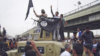 ISIL fighters celebrate on vehicles taken from Iraqi security forces on a main street in Fallujah, a city neighbouring Ramadi, the capital of Anbar province. Reuters / March 30, 2014