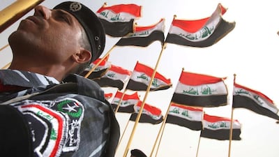 Iraqi soldiers mark the withdrawal of US troops from Iraqi cities and towns in 2009. The reforms passed by Iraq's parliament yesterday change one of the elements of the post-invasion settlement. (AFP PHOTO / MOHAMMED SAWAF)