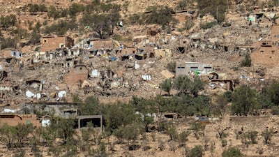 Buildings lie in ruins in Douzrou. Getty Images