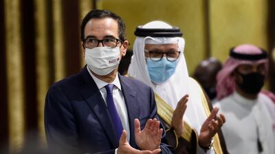 US Treasury Secretary Steve Mnuchin and Bahraini Foreign Minister Abdullatif bin Rashid Al-Zayani arrive to an agreement signing ceremony in the Bahraini capital Manama. AFP