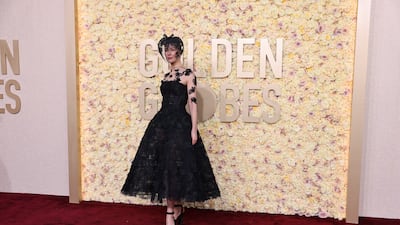 Rosamund Pike in custom Dior. Reuters