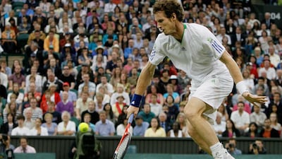Andy Murray makes a backhand return to Croatia's Ivan Ljubicic during their match at the All England Lawn Tennis Championships at Wimbledon