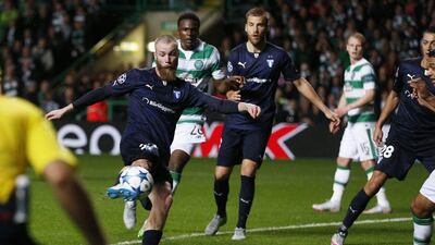 Jo Inge Berget of Malmo scores his side's second goal in the fifth minute of added time to make it 3-2 in the Champions League play-off first leg on Wednesday night against Celtic. Russell Cheyne / Reuters