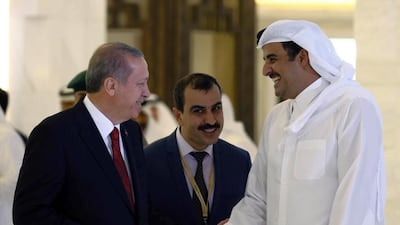 A 2015 photo of Turkey's president Recep Tayyip Erdogan, left, with Qatar's emir, Tamim bin Hamad Al Thani in Doha. Yasin Bulbul / AP