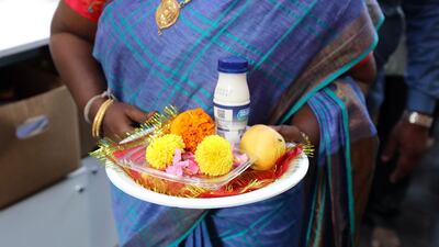 People bring food and flowers to the Shiva Temple during Diwali in Bur Dubai two years ago. Large gatherings and offerings are no longer permitted in temples and other religious places to stem the spread of Covid-19. Chris Whiteoak / The National