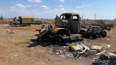 The wreckage of vehicles sits in a field in Syria's southern province of Daraa, on March 11. AFP