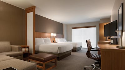 Rooms are well-appointed, with not only a comfy king-size bed and desk but also an L-shaped sofa, footstool and laptop table. Courtesy Hyatt DC