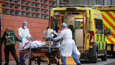Health care workers transport a patient at the Royal London Hospital, as the spread of the coronavirus disease continues, in London, Britain, January 19, 2021. Reuters