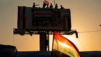 Iraqi demonstrators wave the national flag during an anti-government demonstration in the southern city of Basra. AFP