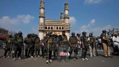 Indian police stand guard in front of the landmark Charminar monument during Friday prayers in Hyderabad.