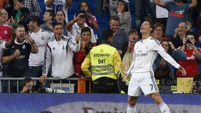 Real Madrid's Cristiano Ronaldo celebrates after scoring one of his three goals against Athletic Bilbao on Sunday in a 5-0 La Liga victory at the Santiago Bernabeu in Madrid. Juanjo Martin / EPA / October 5, 2014
