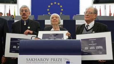 From left, Oleg Orlov, Lyudmila Alexeyeva and Sergei Kovalev accept the 2009 Sakharov Prize on behalf of the human rights group Memorial.