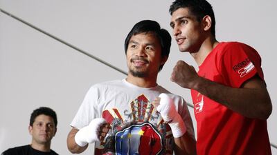 Manny Pacquiao, left, and Amir Khan, right, are edging closer to a fight, expected to take place in the UAE. Steve Marcus / Reuters