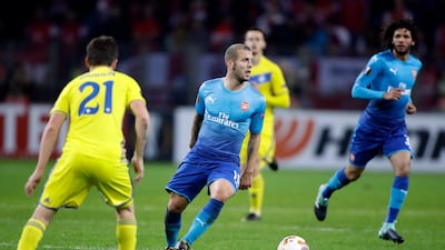 Arsenal's Jack Wilshere, centre, has been in and out of the squad in recent times. Sergei Grits / AP Photo