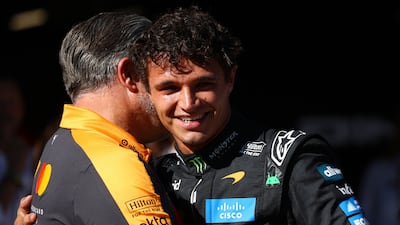 Lando Norris celebrates with McLaren chief executive Zak Brown after sealing pole position for Sunday's Spanish GP. Reuters