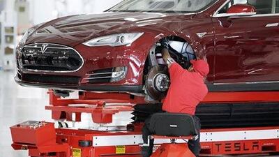 Forecast-beating sales of its Model S, above, will put the American electric car maker Tesla into profit. Paul Sakuma / AP Photo