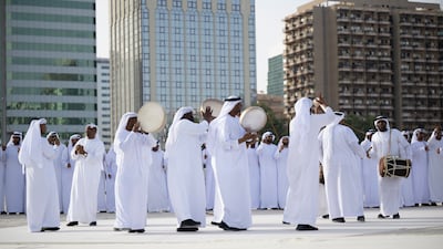 Traditional dancers perform during the group wedding.