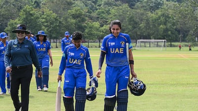 Theertha Satish and Esha Oza walk after completing victory in just five balls against Saudi Arabia in Malaysia. Photo: ACC