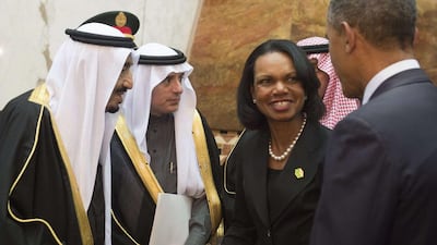 King Salman, left, greets former US secretary of state Condoleezza Rice, centre, who came with the US president to offer condolences after the death of his predecessor Abdullah. Saul Loeb/AFP Photo