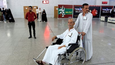 An Iraqi pilgrim arrives at the airport in Najaf on July 31, 2018, before his flight to go attending the annual Hajj pilgrimage. AFP