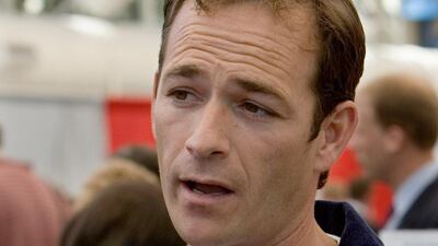 Luke Perry talks to attendees at the Sustainable Biodiesel Summit in San Diego while wearing his Future Farmers of America (FFA) jacket, February 6, 2006. Photo: Reuters