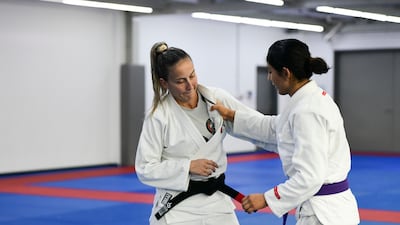 Coach Polyana Lago with UAE's Shamma Al Kalbani during training at the Jiu Jitsu Arena in Abu Dhabi. Khushnum Bhandari / The National