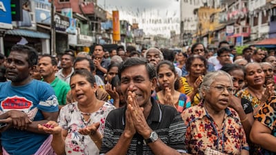 Sri Lankans pray in the street near St Anthony's Shrine one week on from the Easter Sunday attacks in Colombo, Sri Lanka. Carl Court / Getty