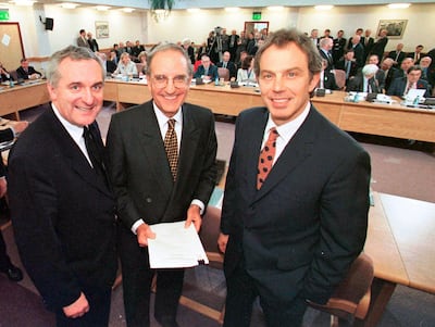 April 10, 1998: (R-L) Former British Prime Minister Tony Blair, US Sen George Mitchell, and former Irish Prime Minister Bertie Ahern, after they signed the Good Friday Agreement for peace in Northern Ireland. AP