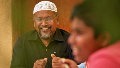 Kalam Noor, right, has lived in the UAE for more than 20 years and now runs a successful tailoring business. Noor, from the island of Tarabunia, Bangladesh, visits his hometown every four or five months to see family and to help his local community.