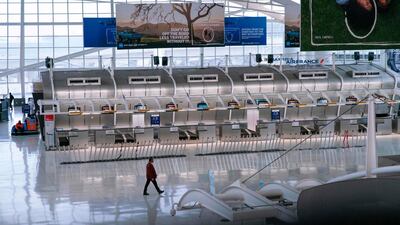 A man walks past the closed Air France counters at the Terminal 1 section at John F. Kennedy International Airport in New York City. AFP