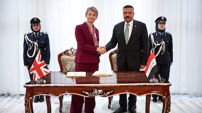 Ms Cooper and Mr Al Shimmari after signing a joint statement on border security following a meeting at the Interior Ministry in Baghdad