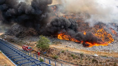 Firefighters work at the scene of an inferno at a landfill site in Solo, Central Java, Indonesia. AFP