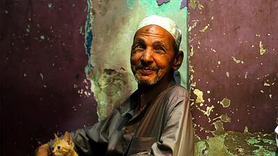 Photo by Nouni Azo of a man enjoying tea and shisha after breakfast at a coffee shop in Cairo, Egypt. Courtesy National Geographic Abu Dhabi