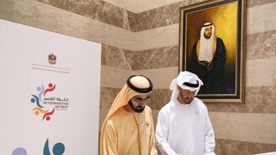 The leaders sign a document during the Determination Retreat.