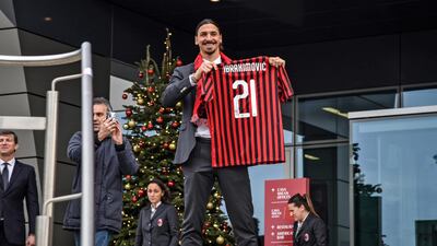 latan Ibrahimovic poses with his new jersey. EPA