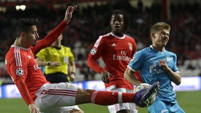 Benfica’s Andre Almeida, left, fights for the ball against Zenit's Oleg Shatov during a Champions League Round of 16 first leg match at Benfica's Luz stadium in Lisbon, Portugal, Tuesday, Feb. 16, 2016. (AP Photo/Armando Franca)