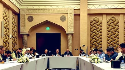 A handout picture provided by the Afghanistan Peace Negotiation Team on September 15, 2020 shows negotiators from the government of Afghanistan preparing before their meeting with representatives of the Taliban. AFP