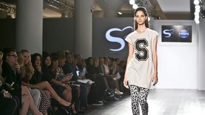 Fresh off her third straight US Open win, Serena Williams took on New York Fashion Week with her first runway show, as a celebrity crowd that included the Vogue editor Anna Wintour watched from the front row. The tennis champ said she was working on the collection, a mix of casual and dress clothes for the shopping network HSN, even while she was mowing down competitors at the US Open — casting models and choosing their looks. She was inspired by couture shows such as Dior, but with a toned down vibe, she said. She captured the title by defeating her good friend Caroline Wozniacki, who showed up at the show to support Williams. Bebeto Matthews / AP photo