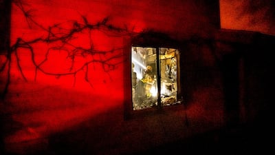 A firefighter puts out flames in a burning home as the Mountain View Fire tears through the Walker community in Mono County, California. AP Photo
