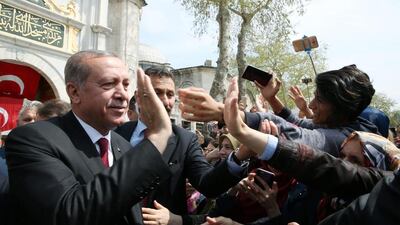 Turkish president Recep Tayyip Erdogan greeting his supporters as he leaves Eyup Sultan mosque in Istanbul, Turkey on April 17, 2017. Yasin Bulbul / Presidential Palace / Handout via Reuters