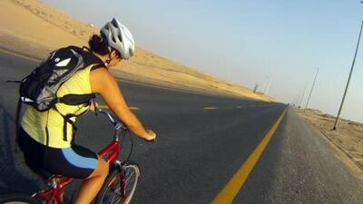 Dina Ghandour trains on Al Qudra Road in preparation for Cycling4Gaza.