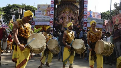 Musicians perform in front of a 50-feet tall clay idol of the Hindu deity, marking the Ganesh Chaturthi festival in Hyderabad. AFP