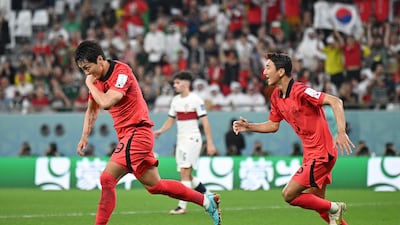 Kim Young-gwon celebrates scoring for South Korea.