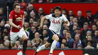 Tottenham's Son Heung-min is chased down by Manchester United's Phil Jones. Jason Cairnduff / Reuters