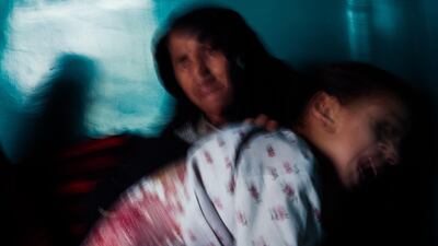 A young Afghan girl cries as her wounds are cleaned after being injured in a bombing in Kabul in January 2019. Ivan Flores/The National