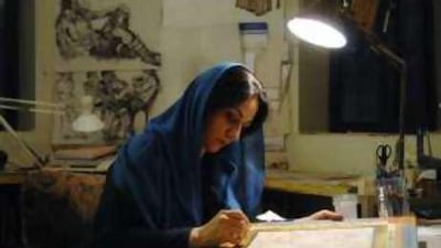 Farah Ossouli, the renowned contemporary artist, works in her studio in Tehran.