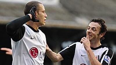 Fulham's Bobby Zamora, left, celebrates with teammate Simon Davies after scoring against Notts County.