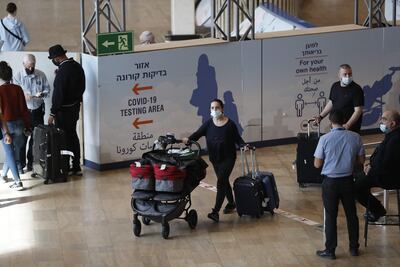 Passengers arrive at Israel's Ben Gurion Airport. AFP