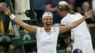 Kirsten Flipkens of Belgium celebrates after defeating Petra Kvitova of the Czech Republic in their women's quarter-final tennis match at the Wimbledon Tennis Championships, in London July 2, 2013. REUTERS/Eddie Keogh (BRITAIN - Tags: SPORT TENNIS) *** Local Caption *** WIM142_TENNIS-WIMBL_0702_11.JPG